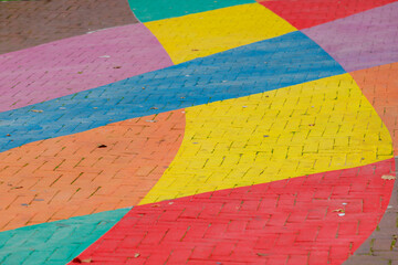 Colourful bricks footpath, Multicolor painted on outdoor path, Rainbow coloured on street, Symbol of gay, Lesbian, Bisexual and transgender, LGBT social movements, Abstract background.