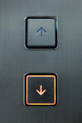 metallic elevator button with arrow design © MICHEL