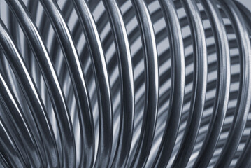 Metallic spring close up shot. Abstract background.