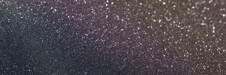 Black glitter bokeh circle glow blurred and blur abstract. Glittering shimmer bright luxury . White and silver glisten twinkle for texture wallpaper and background backdrop.
