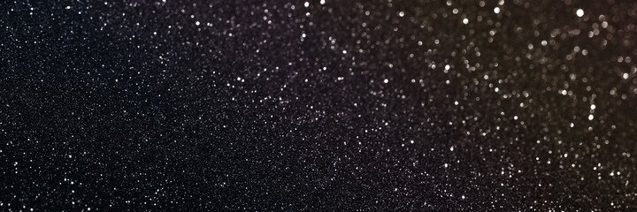 Black glitter bokeh circle glow blurred and blur abstract. Glittering shimmer bright luxury . White...