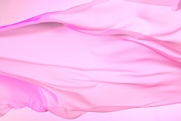 Naklejka premium Smooth elegant colorful transparent cloth separated on white background. Texture of flying fabric.