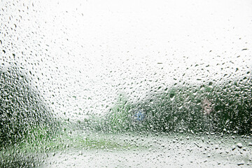 Rain drop​let on the car's glass.