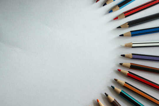 Set of colored pencils on a white background