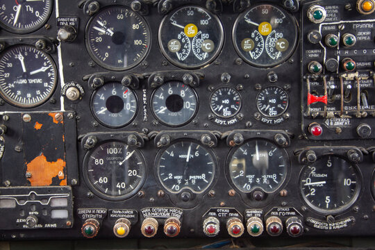 The dashboard of an old plane. Instruments and switches in the cockpit of an old plane
