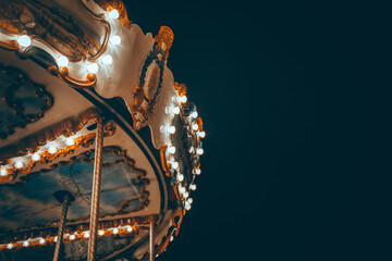 Children's carousel and glowing lights at night. Kazan, Russia - 8 May 2021
