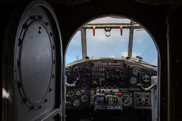 The dashboard of an old plane. Instruments and switches in the cockpit of an old plane