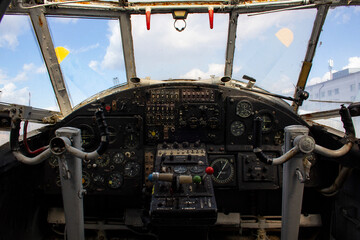 The dashboard of an old plane. Instruments and switches in the cockpit of an old plane