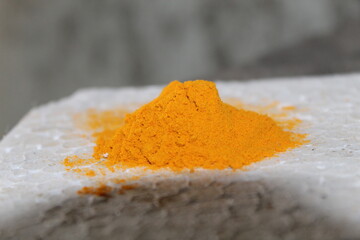 close up of a pile of turmeric
