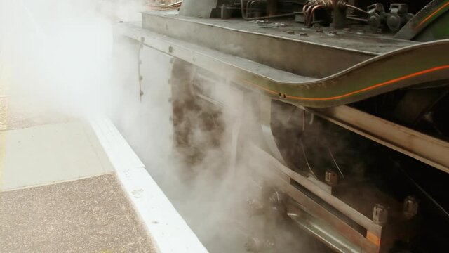 Stunning detail of a steam locomotive preparing to depart on a heritage trip