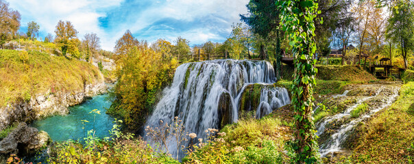 Panorama of the natural park in autumn season, with colorful trees and a waterfall in Rastoke, Croatia