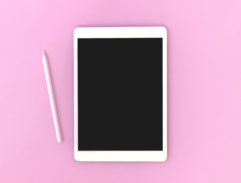 Tablet mockup screen with stylus pencil for drawing and artist, colorful pink background, copy space photo