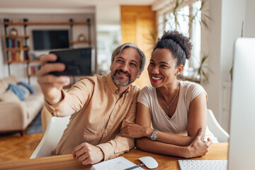 People using phone camera, taking photos, smiling face.