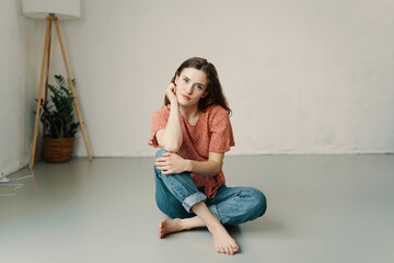 Unimpressed serious young woman staring intently at the camera