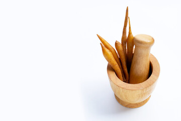 Fingerroot in wooden mortar with pestle