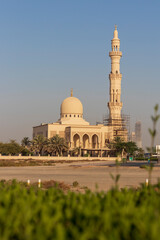 Fototapeta na wymiar Dubai, UAE - 05.21.2021 - Mosque in final stages of construction in Nad Al Hamar area of Dubai. Religion