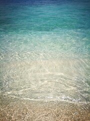 Photograph of the transparent sea and the beautiful sand, as a sample of union and harmony, on an island of Venezuela.