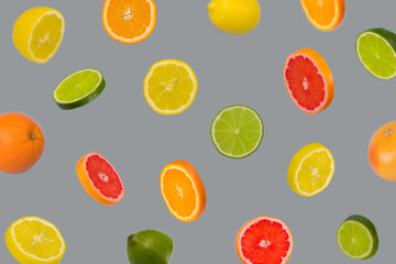 Minimal idea with fresh orange, lemon, lime and grapefruit sliced on a ultimate gray background.