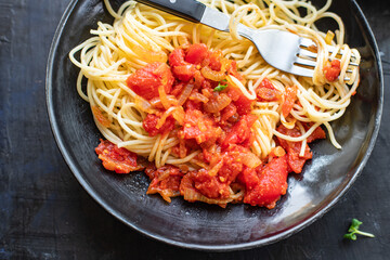 spaghetti tomato sauce pasta bolognese sauce vegetables salsa italian cuisine classic recipe on the table healthy food meal snack copy space food background rustic. top view