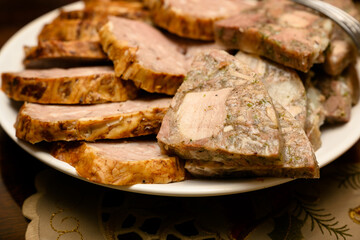 Sliced sausage and sirloin on a plate.