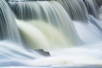 Fototapeta na wymiar Landscape captured with blurred motion of a cascade on the Rabbit River, Michigan, USA