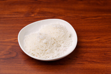 Noolappam , idiyappam rice noodles, string hopper popular traditional steam cooked Kerala breakfast dish with hot and spicy chickpea curry,  Tamil Nadu, India. South Indian noolputtu Sri lankan food.