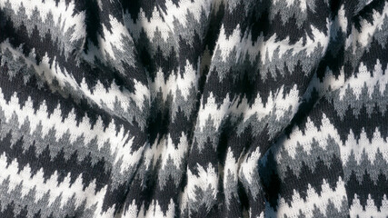 Estampado en zig zag de líneas blancas, grises y negras en tejido de lana