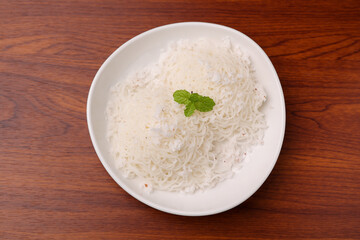 Noolappam , idiyappam rice noodles, string hopper popular traditional steam cooked Kerala breakfast dish with hot and spicy chickpea curry,  Tamil Nadu, India. South Indian noolputtu Sri lankan food.