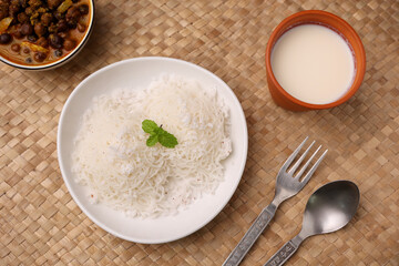 Noolappam , idiyappam rice noodles, string hopper popular steam cooked Kerala breakfast dish hot and spicy chickpea curry , sweet coconut milk Tamil Nadu, India South Indian noolputtu Sri lankan food.