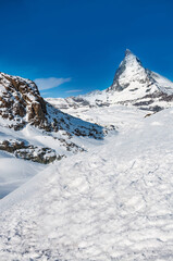 Fototapeta na wymiar Matterhorn peak in sunny day, Switzerland. Matterhorn (peak Cervino) in Swiss Alps.