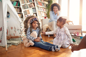 Kids spending a quality time with their Mom at home together. Family, together, love, playtime