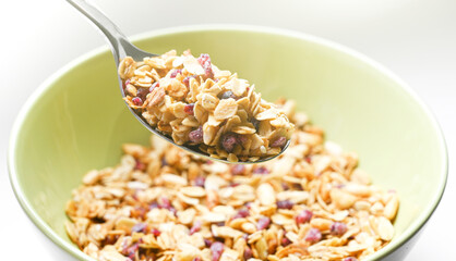 Close up of a spoon with granola sugarless. Helathy breakfast and food. Sunny morning
