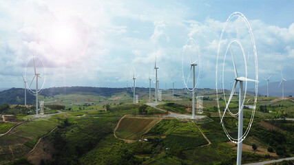 Aerial view of windmills with digitally generated holographic display tech data visualization. Wind...