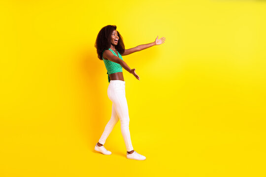 Full length body size photo funky girl smiling inviting hugging missing going on meeting isolated vibrant yellow color background