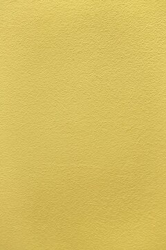 Gold textured background.  Simple goldish surface and light foil texture effect.  Plain backdrop, blank template, golden wallpaper with copy space for invitations, backdrops, websites, etc.
