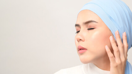 close up of young beautiful muslim woman with hijab isolated on white background studio, muslim beauty skin care concept.