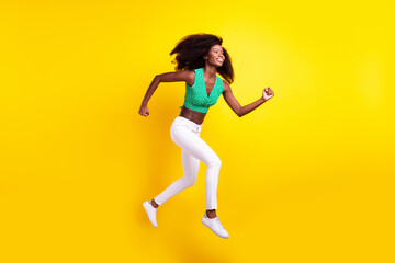 Full length body size photo woman jumping running on meeting late smiling isolated bright yellow color background
