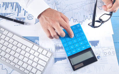 Businessman using calculator for analysis marketing plan. Business, Accounting
