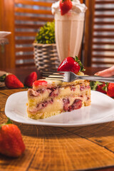 Perfect Strawberry Cake Slice on a Wooden Table High Res