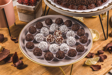 Various Chocolate Sweeties and Dessert on a Wooden Table
