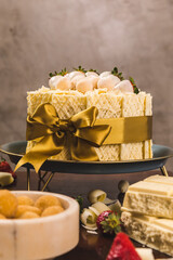 Delicious White Chocolate Cake On a Perfect Table With Snacks