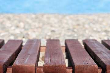 Summer seashore background with wood base and sea view	