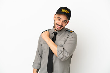 Young security  caucasian man isolated on white background celebrating a victory