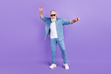 Full length photo of aged man happy positive smile have fun dance party isolated over purple color background