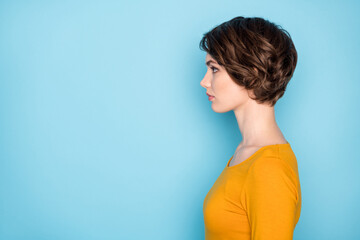 Profile portrait of nice serious brunette lady look empty space wear yellow shirt isolated in vivid...