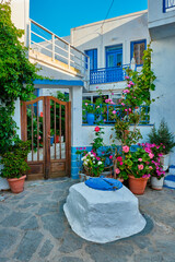 Fototapeta na wymiar Greek village typical view with whitewashed houses and stairs. Plaka town, Milos island, Greece