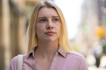 Young caucasian woman in city