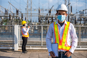 Electricians with protective face mask for coronavirus (covid-19) in the workplace.