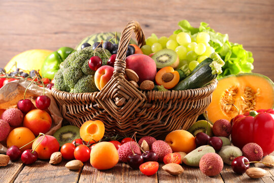 fruits and vegetables on wood background