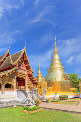 Fototapeta premium Chapel and golden pagoda at Wat Phra Singh Woramahawihan, famous travel destination in Chiang Mai, Thailand